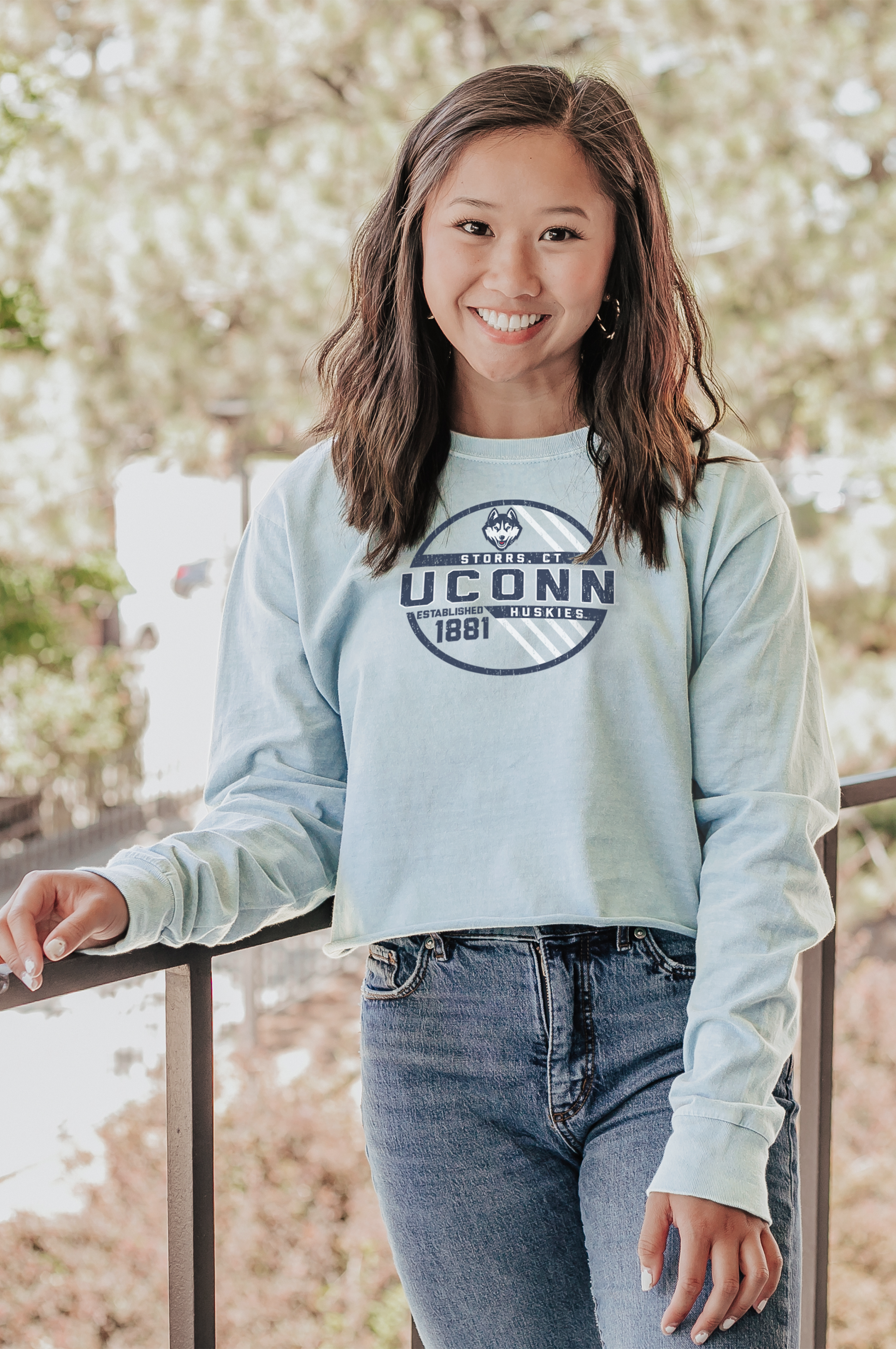 Female model wearing college Blue 84 college cropped longs sleeve garment.