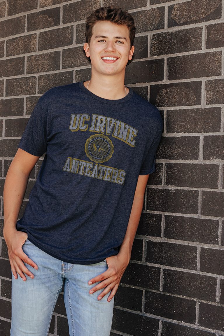 Male model wearing a college Blue 84 t shirt.