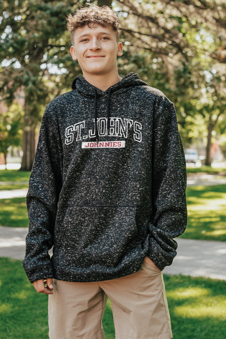 Male model wearing college Blue 84 hooded sweatshirt.