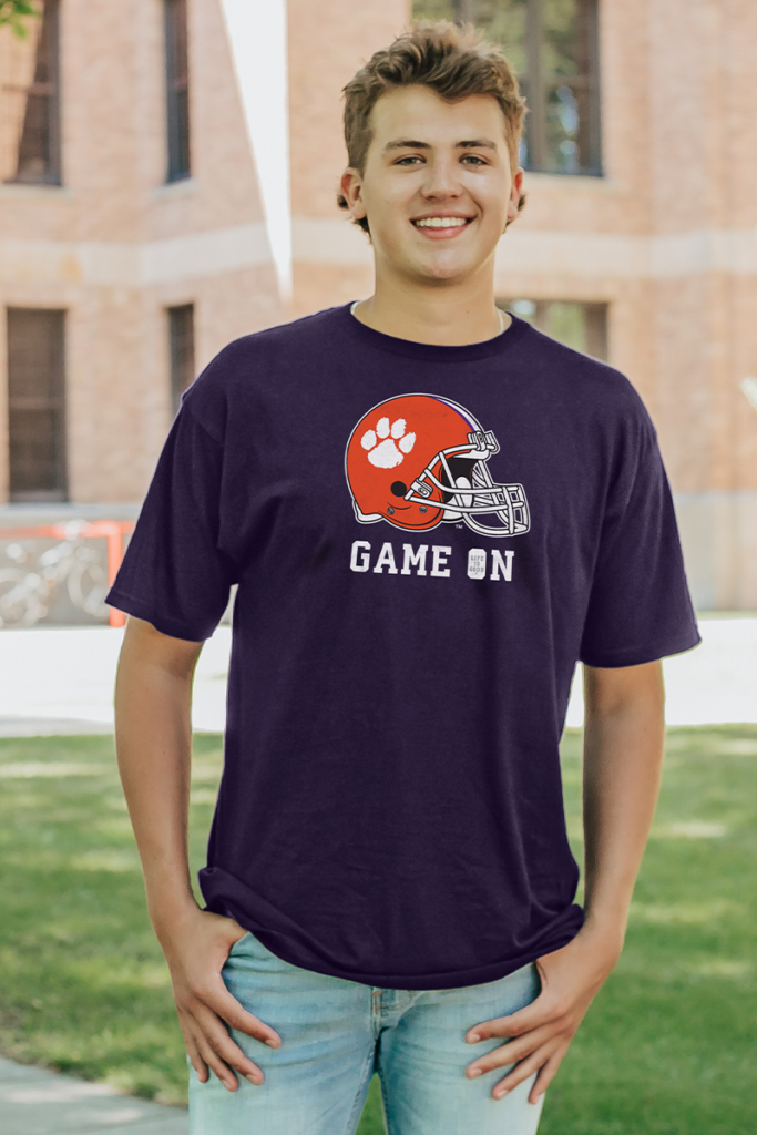 Male model on college campus wearing a college Life is Good graphic t-shirt.